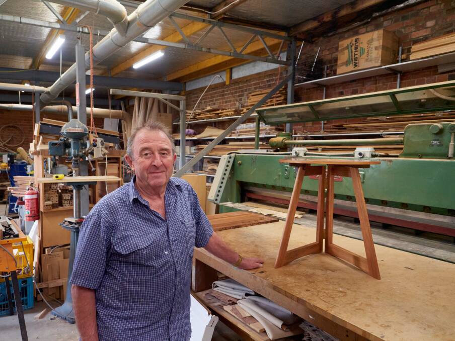 Rex Heathcote with one of his iconic folding tables at his workshop in Longford. Picture by Rod Thompson. 