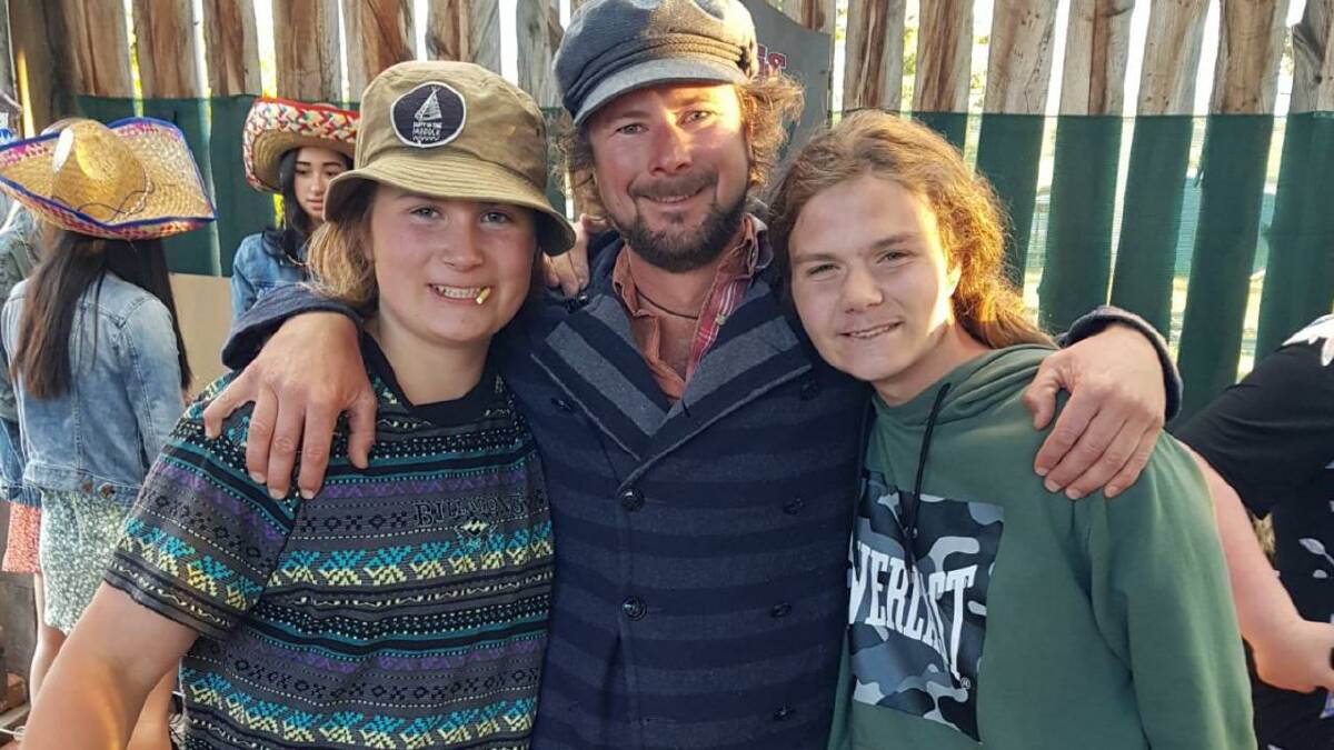 Nick Chugg (centre) started a music festival in honour of his son, Zander (right), where he'll perform this year in a band with his other son, Jo (right). Picture supplied