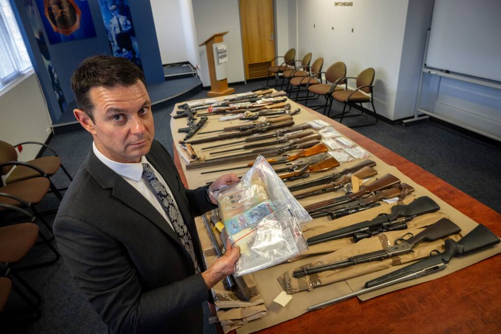 Detective Inspector Nathan Johnston with firearms, cash and quantities of ice, cocaine, ecstasy and cannabis seized through targeted operations across the North. Picture by Paul Scambler