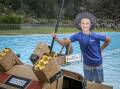 Ollie Reid, 10, from Riverdsale and his Delorean MkII boat after winning his event. at Youngtown Rotary's Soggy Bottom Regatta. Picture by Craig George