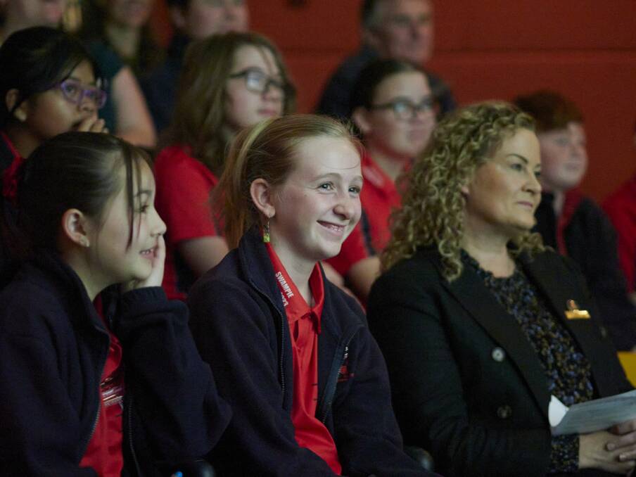 Invermay Primary students Zoey Franklin (11) and Maggie Spencer (12) with Councillor Lindi McMahon, watching the students' short film. Photo by Rod Thompson