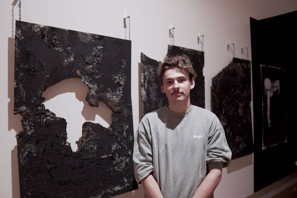 St Patrcik's College student and artist Thomas Crack with his work at ArtRage, titled 'Self Discovery'. Picture supplied