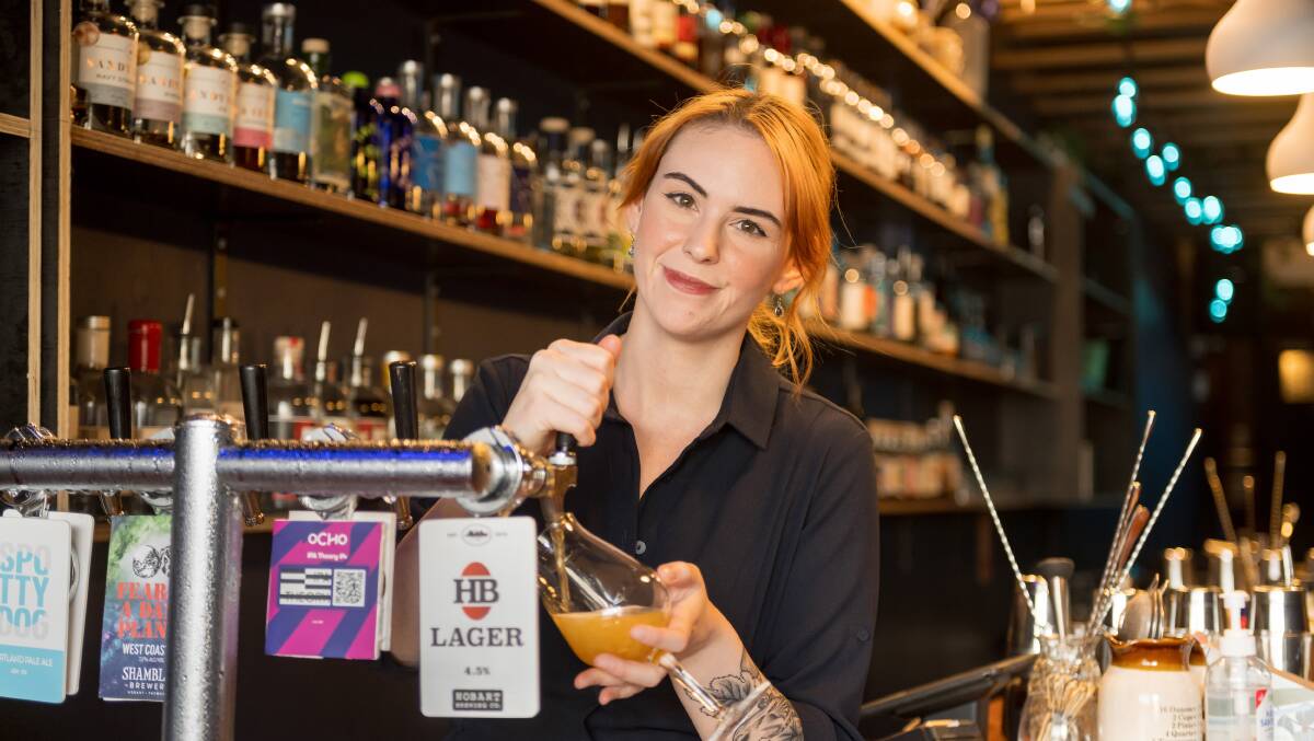 Bar manager Hannah Treloar behind the bar at The Barrel Collective. Picture by Phillip Biggs