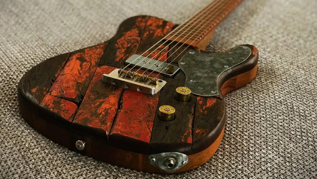 The extraordinary work of Sarah Hicks: once a wagon wheel, now an electric guitar, resplendent with shot gun cartridge knobs. Picture supplied.