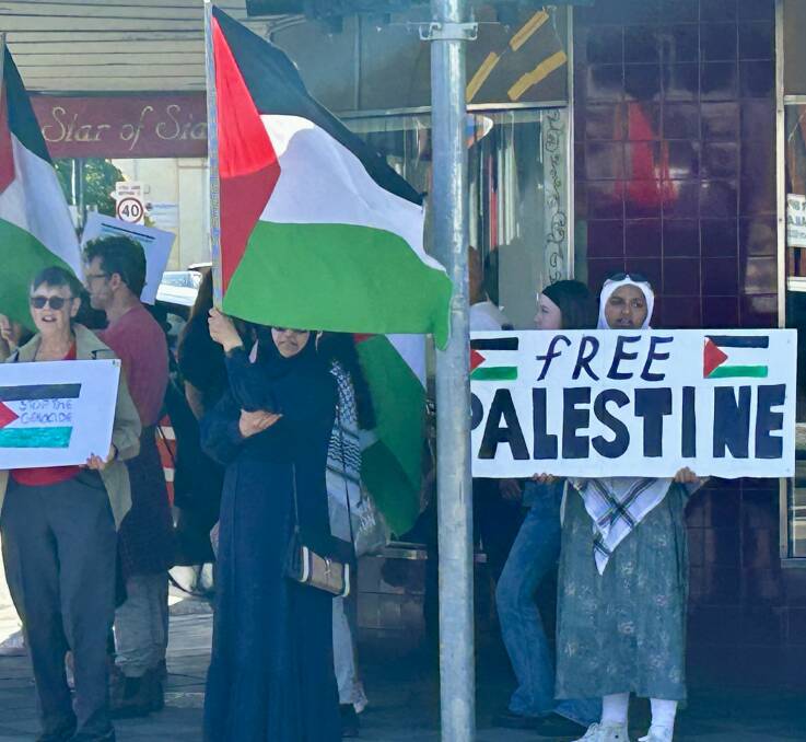 A group of pro-Palestinian protesters march in Launceston's CBD. Picture by Hugh Bohane.