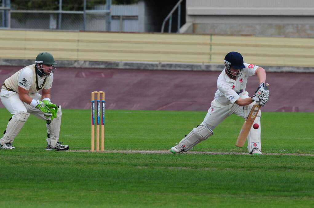 PREPARATION: Sheffield wicket keeper Alex King readies himself while Devonport batsman Josh Brown steps into his shot. Devonport proved too good for Sheffield but both have made it to the semis. Picture: Paul Scambler