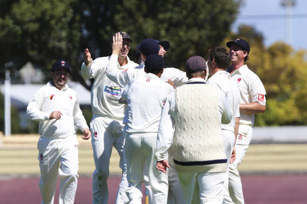 Ladder leaders Devonport celebrate after the fall of another Sheffield wicket.
