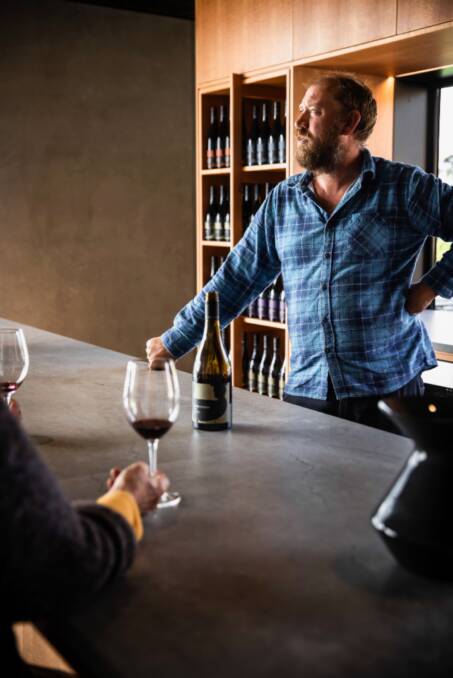 VIEW TO A DROP: Winemaker Jonny Hughes at the new tasting bar. Picture: Dearna Bond.
