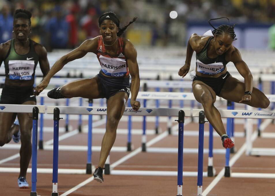 OFF AND RUNNING: Kendra Harrison (USA) clears a barrier on her way to winning the women's 100-metre hurdles race in the Qatar Diamond League meet which kicked off the global competition. Pictures: AP Photo/Kamran Jebreili)