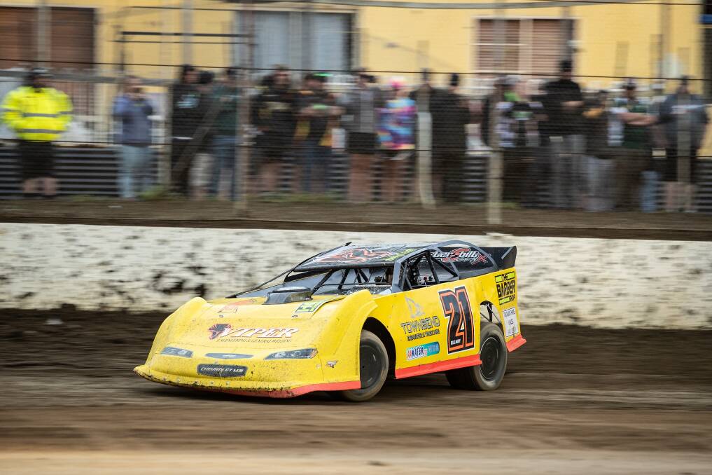 NEED FOR SPEED: Ash Cleary in action in his late model sedan at Hobart Speedway. Picture: Angryman Photography 