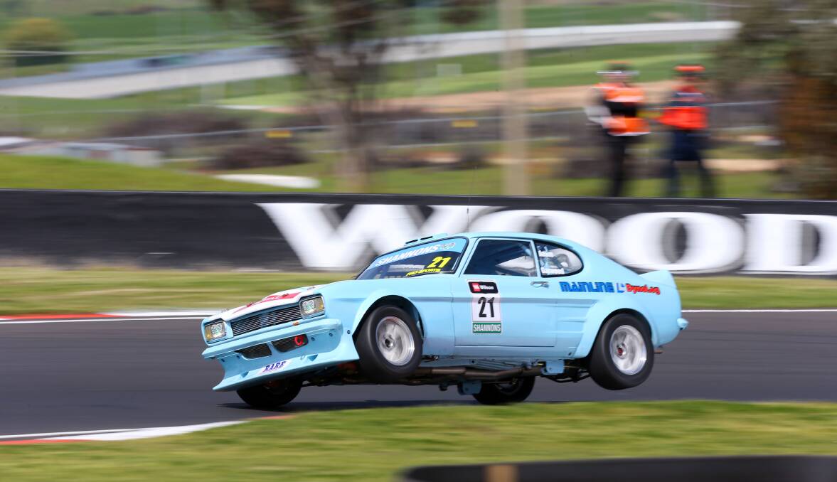 TAKE OFF: Adam Garwood mixed it with the best at Bathurst last weekend when he competed in the Touring Car Masters series races. He took to the track in a Ford Capri Perana.