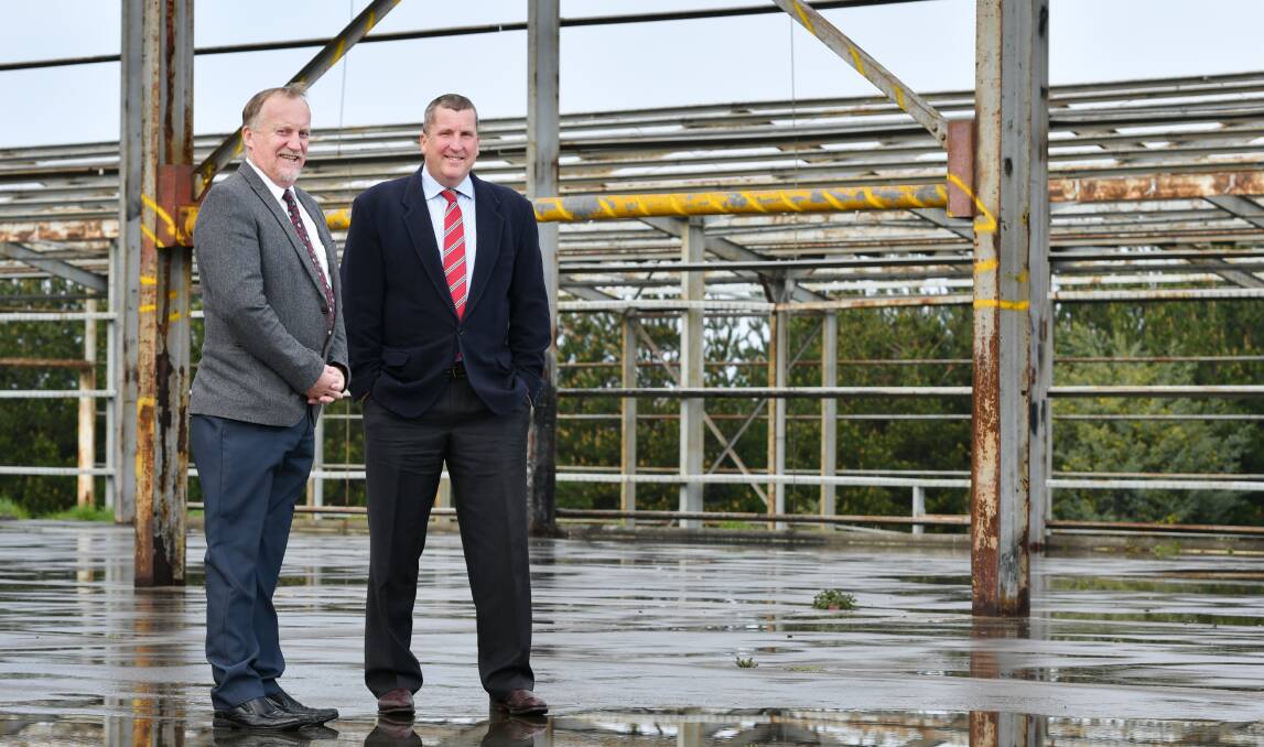 NEW LIFE FOR OLD MILL: Latrobe council Mayor Peter Freshney congratulates BioMar's Alasdair Bradley on breathing new life into Wesley Vale's former particle board factory. Picture: Brodie Weeding