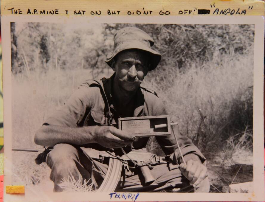 An image from Terry Tangney's briefcase filled with pieces from his time of war, captioned 'The A.P. mine I sat on but didn't go off - Angola'. 