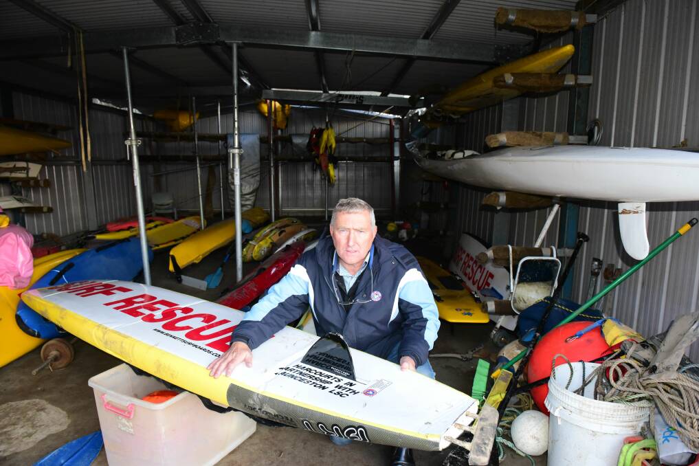 Launceston Surf Life Saving Club president Geoff Lyons with damaged Surf Rescue Boards at their shed earlier this year.
