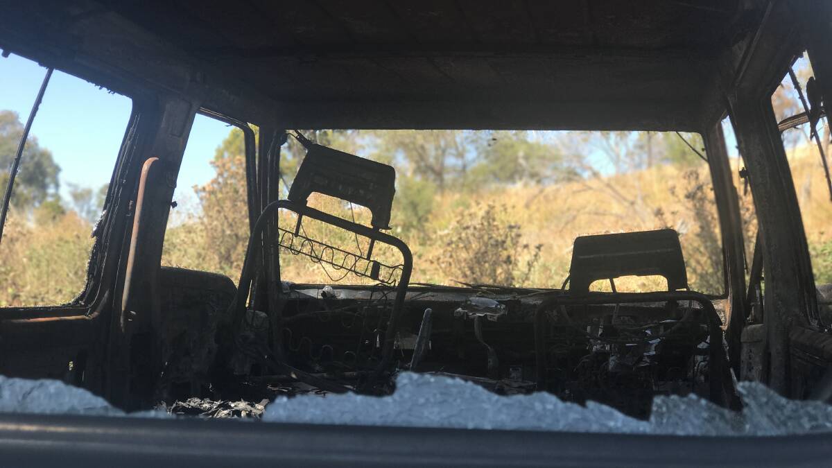 FIRE DAMAGE: The inside of a burnt out van found on a vacant block in King Billy Crescent at Rocherlea. The van was one of three vehicles found to have been dumped on the block and destroyed by fire. Picture: Melissa Mobbs