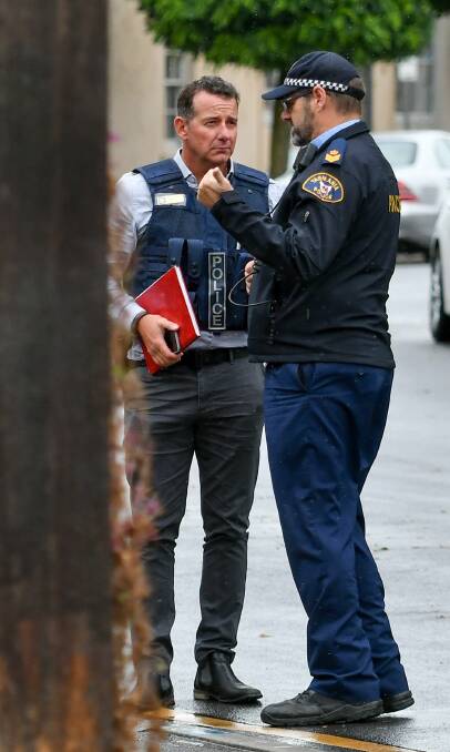 Launceston CIB Detective Inspector Craig Fox and Senior Sergeant Mike Gillies on the scene after a robbery at the Evandale Post Office. Picture: Scott Gelston.
