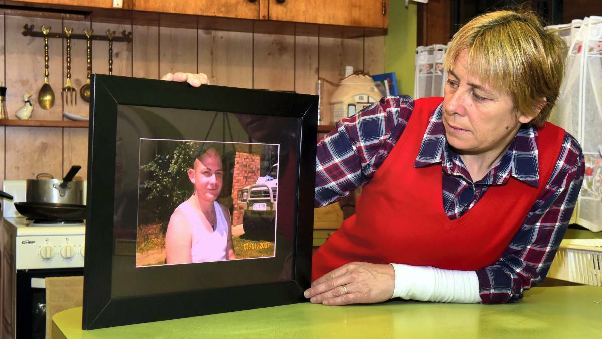 Lillian Watkins with a photo of her son, Chris. Picture: Neil Richardson
