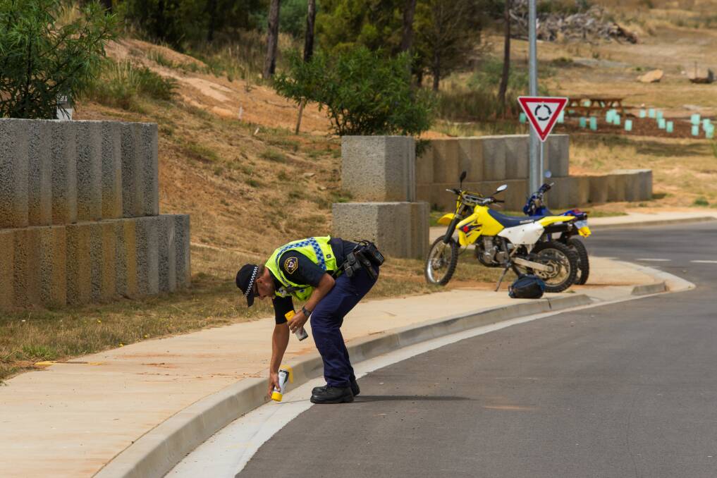 TEEN DEAD: Tasmania Police crash investigator, First-Class Constable Nigel Housego, at the scene of a fatal motorbike crash at Riverside on Thursday. Picture: Phillip Biggs