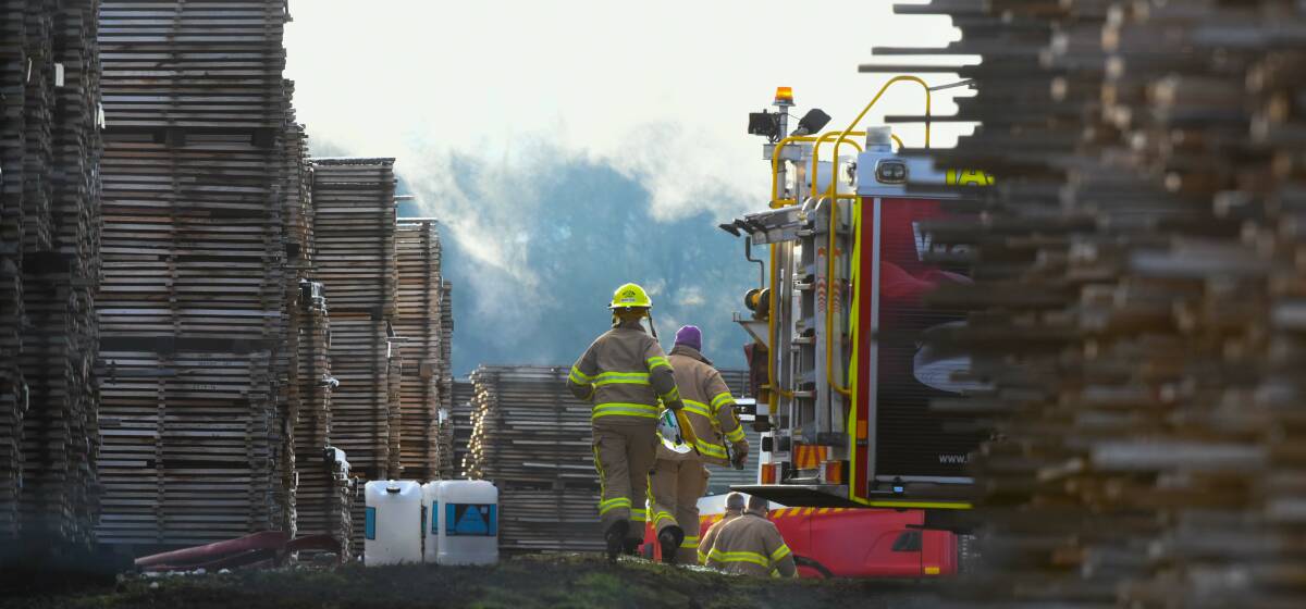 ON SCENE: More than 44 firefighters were involved in fighting a timber yard fire on Tuesday night and throughout the day on Wednesday. Picture: Neil Richardson