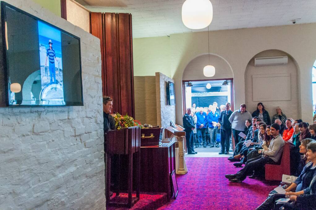 PAYING TRIBUTE: The chapel was overflowing with guests during the funeral service for Rosevale man Kevin Cuthbertson, who died after a tragic accident at his home. Picture: Phillip Biggs
