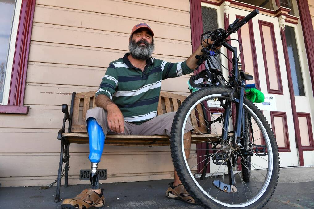 Marc Burri with the bike left by a thief who stole his from outside a Launceston hostel. Picture: Neil Richardson