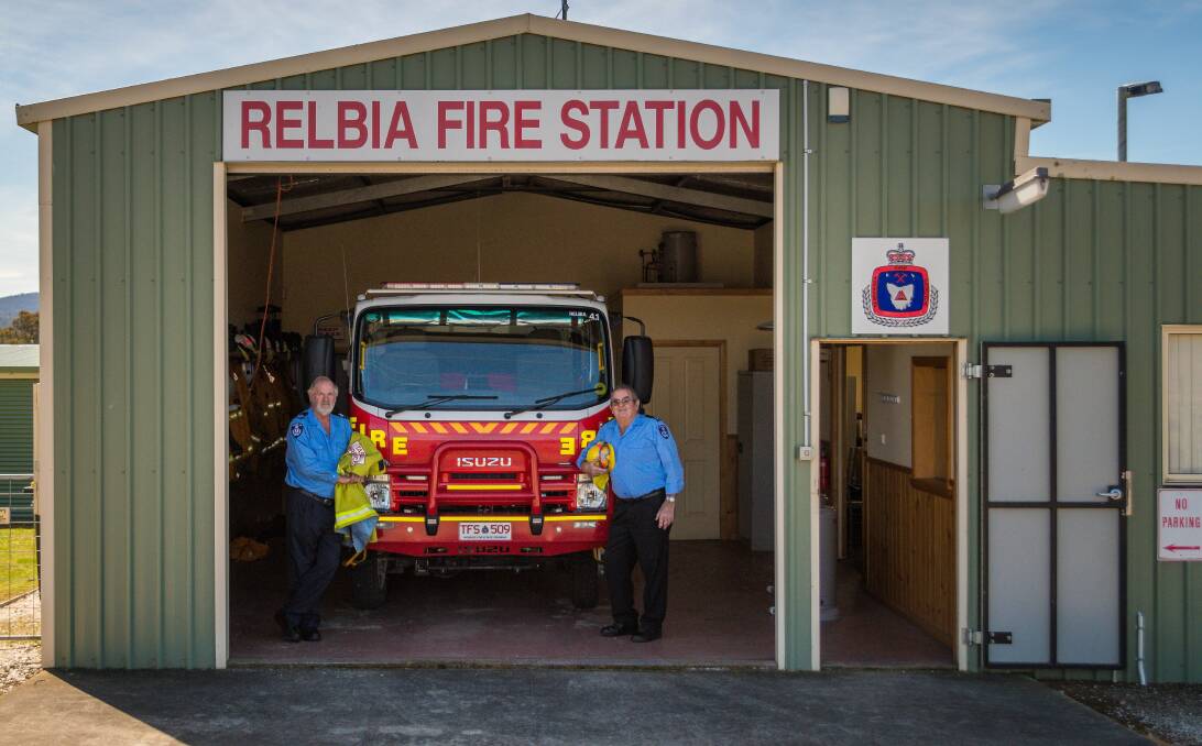 COMMUNITY SERVICE: Relbia-based firefighters Rodney Springer and Greg Wise have been volunteering for 50 years. Pictures: Phillip Biggs