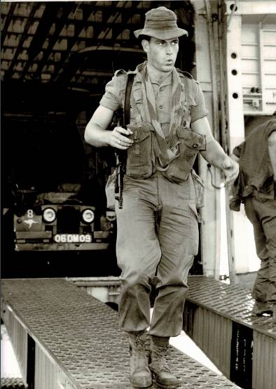 Private Robert Millwoodas whistling his way down the ramp of an RAF Beverly Freighter Aircraft at Changi Airfield, Singapore. Picture: Supplied by Launceston RSL