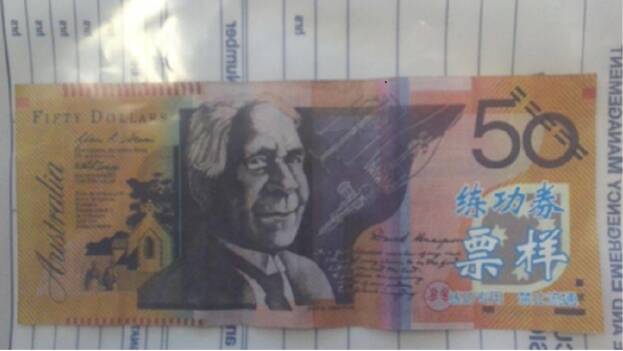 The fake notes have blue Chinese characters written on the window. Picture: Tasmania Police