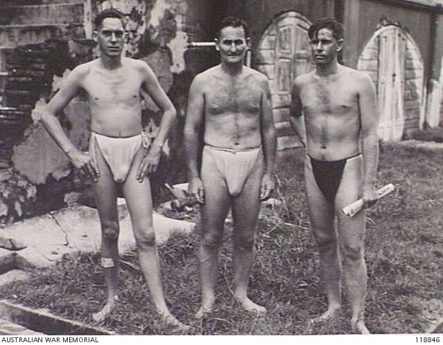 Australian men from 8th Division showing their "Jap nappies", worn by prisoners of war.