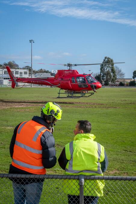 ON THE JOB: A helicopter was hired to help dry out Windsor Park Oval at Riverside ahead of a footy semi-final on Saturday. Picture: Paul Scambler
