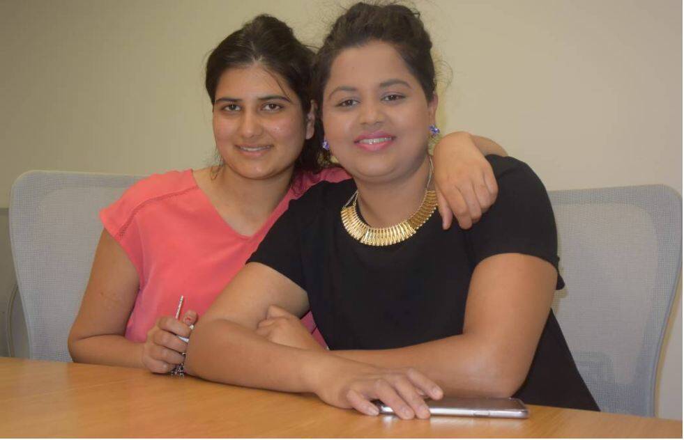 Yashoda (right) with her sister Kesabi before her graduation ceremony in December.