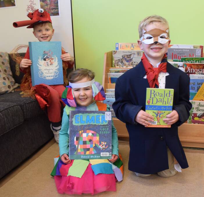 BOOK WEEK: St Thomas More's Catholic Primary School students Taj Lewis, 5, Emily Stacey, 4, and Lewis Eldershaw, 5, dressed up as their favourite characters for Children's Book Week. 