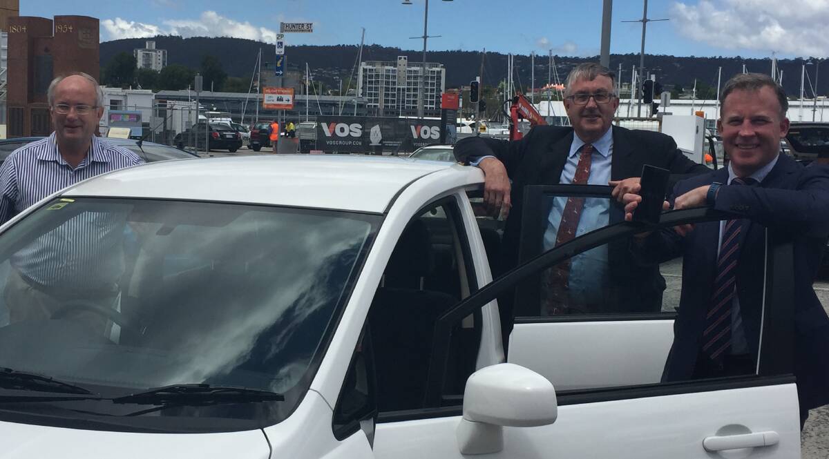 UBER OFFICIAL: Tasmania's first Uber driver Hans Willink with Infrastructure Minister Rene Hidding and Premier Will Hodgman at the launch of the ride-sharing service.