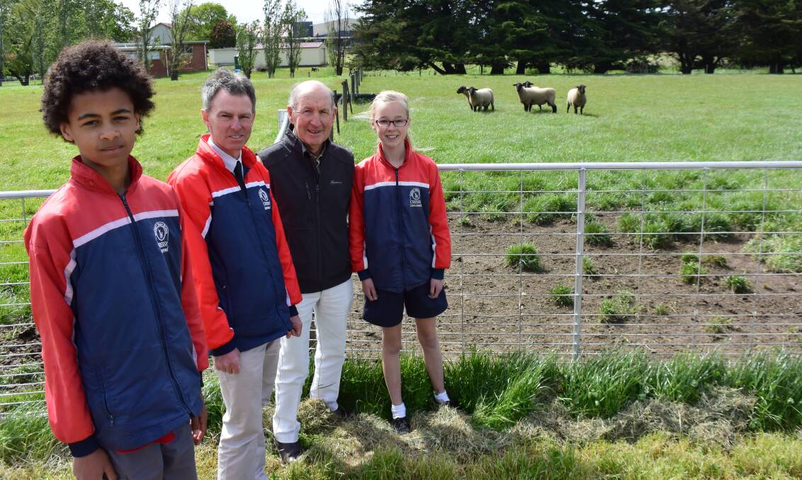 FARMING: Cressy District High School year 7 students Fareed Hassan and Sarah Dixon, both 13, with principal Craig Brown and farm management committee chairman Terry Connell. 