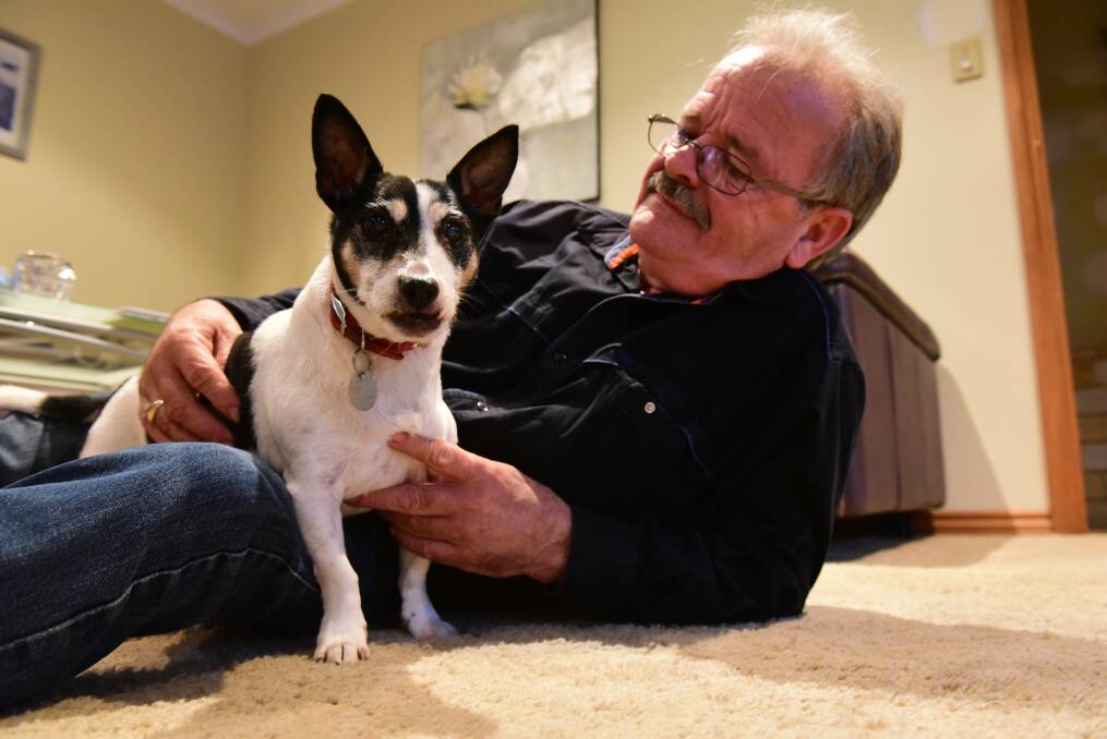 EARS PRICKED: Jed the Jack Russell mixed breed with his loving owner, Mike Richardson, at their Kings Meadows home. Picture: Paul Scambler 