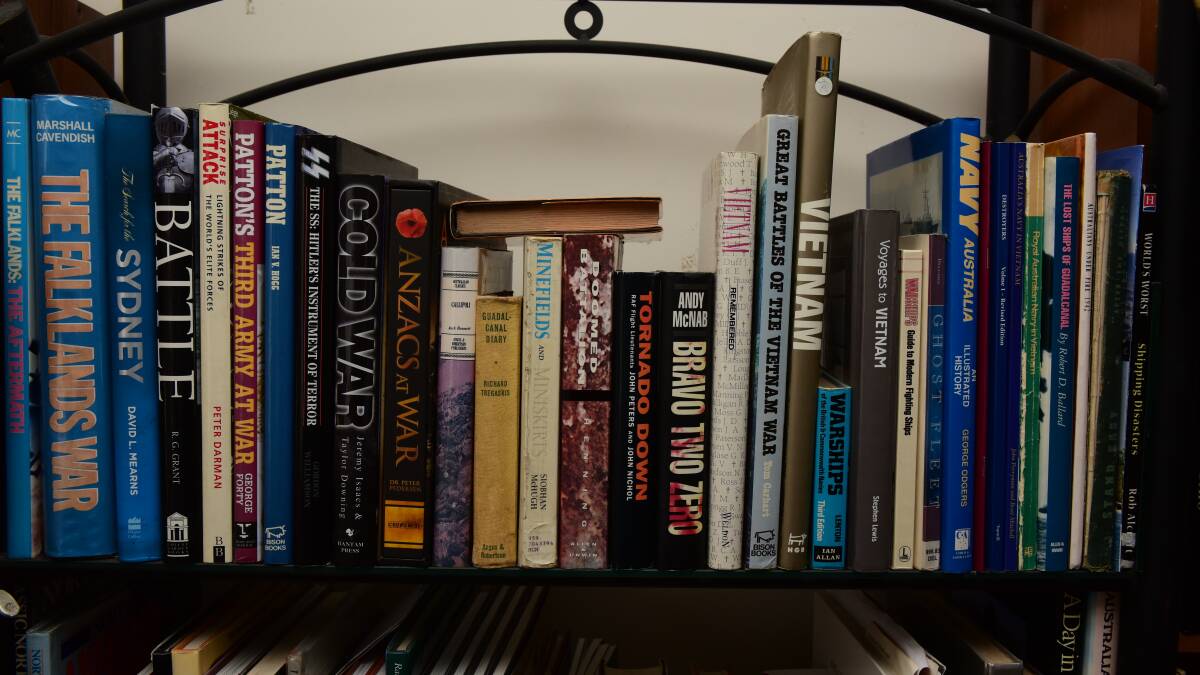 BOOKS: Mr Gleadhill's home has a library of 545 books, including many about the Vietnam War. 