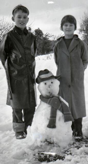 SNOWMAN: Ross Warren with his sister Rae and a snowman at Tarraleah. 