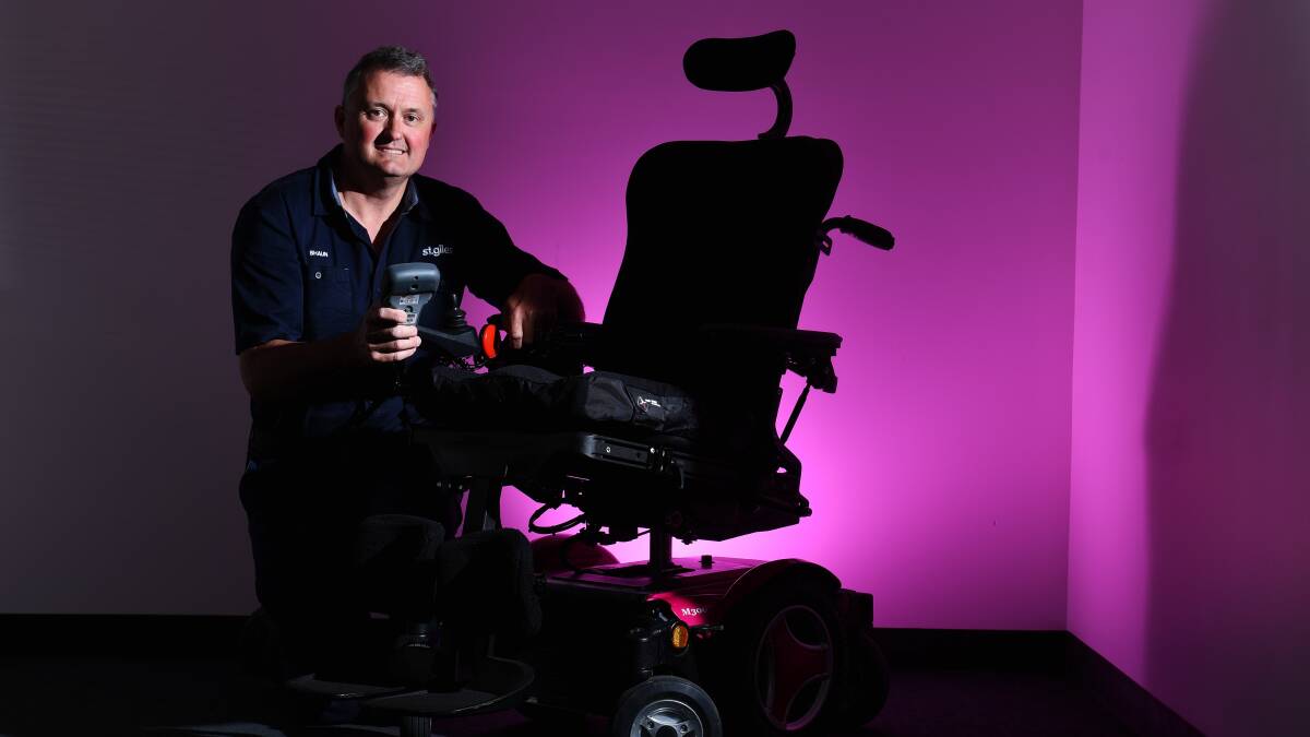 PROMOTING POSSIBILITY: St Giles Mobility Clinic seating team seating technician Shaun Lyall, with a customised wheelchair at St Giles, went to a Melbourne 'makeathon'. Picture: Scott Gelston