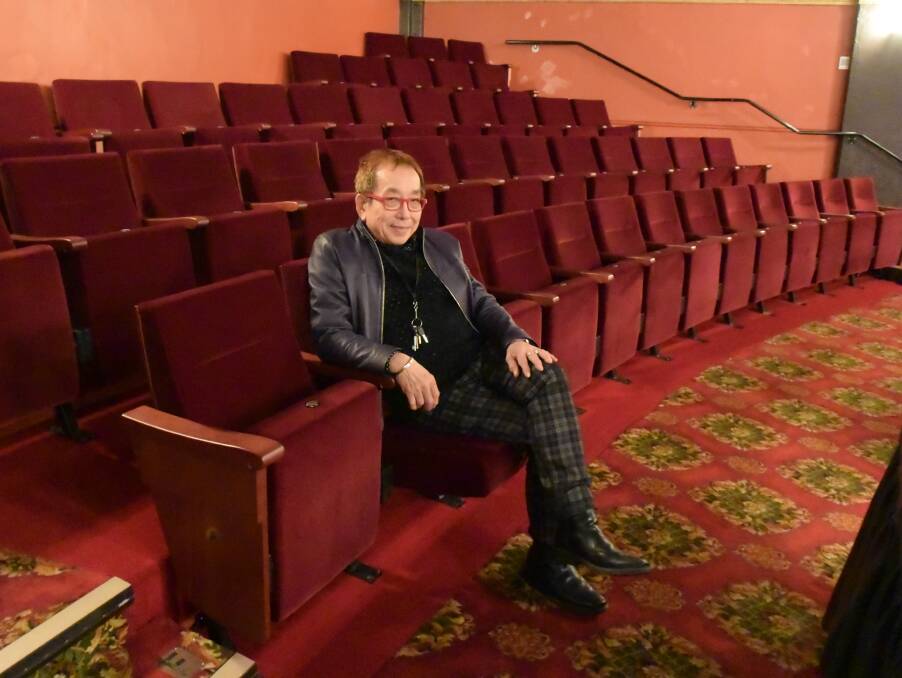 IN WITH THE NEW: Theatre North general manager Greg Leong reclines in the theatre's new seats, installed during recent renovations. 
