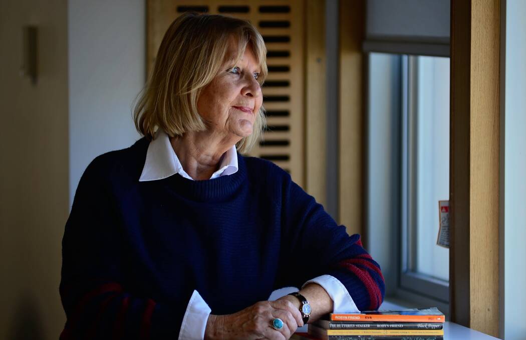 REFLECTING: Well-known author Robyn Friend, of Launceston, who has been nominated for the prestigious Alice Award, with some of her published works. Picture: Phillip Biggs 