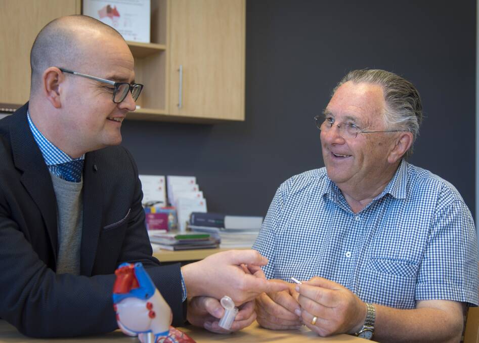 CHECK UP: Dr Stewart Healy checks in with Brian Bartlett, recipient of the world's smallest pacemaker, at Charles Clinic Heart Care. Picture: Supplied