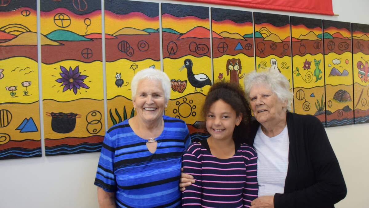 EMBRACING ART: Valma Tiffin, Ella Hollis, Tasmanian Aboriginal elder and poet Phyllis Pitchford at the Kings Meadows Community Health Centre.
