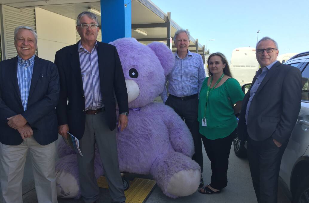 Road Safety Advisory Council chairman Jim Cox, Infrastructure Minister Rene Hidding, Bridestowe Lavender Estate managing director Robert Ravens, Europcar Tasmania operation manager Brigitte Schroeder and Launceston Airport general manager Paul Hodgen, standing with Bobby the Bear. 