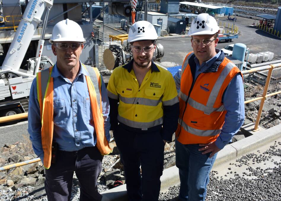 POWER UP: Tony Szabo, David Palfreyman and Brad Turner stand behind the 58MW combined cycle gas turbine at Tamar Valley Power Station.