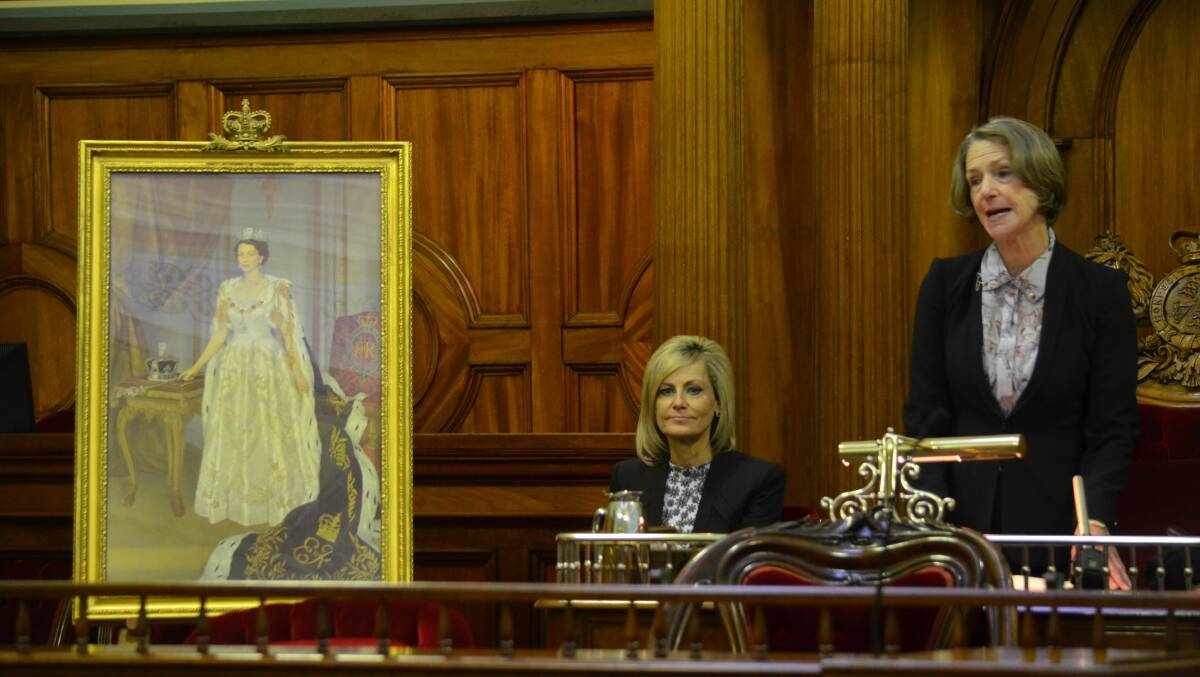 Speaker Elise Archer and Governor Kate Warner with a portrait of the Queen.
