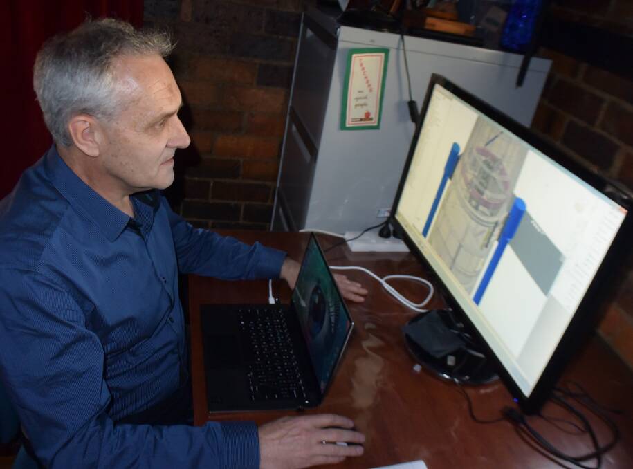 WORK-LIFE BALANCE: Astronomy engineer David Brown working on the design for the UKST telescope. 