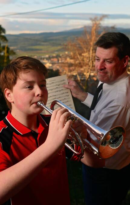 YOUNG TALENT: Stuart Stenton plays the cornet, with City of Launceston RSL Band musical director, Steven English. Picture: Phillip Biggs