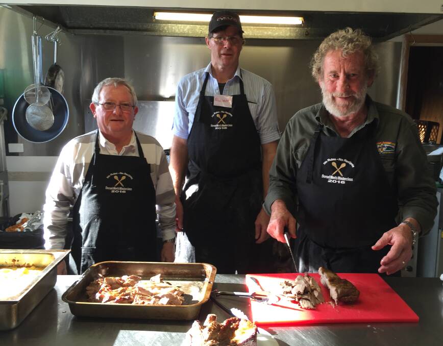 YUM: Wayne Donnelly, William Johnson and Craig Williams prepare a lamb dish as part of a three-course meal. 
