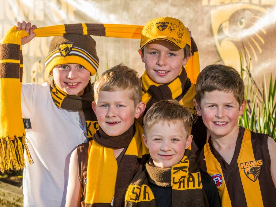 EXCITED: Junior Hawks fans Will O'Shea, Ben Watson, Jasper Brown, Angus O'Shea, and James Watson, ready for Saturday's game at UTAS Stadium. Picture: Phillip Biggs