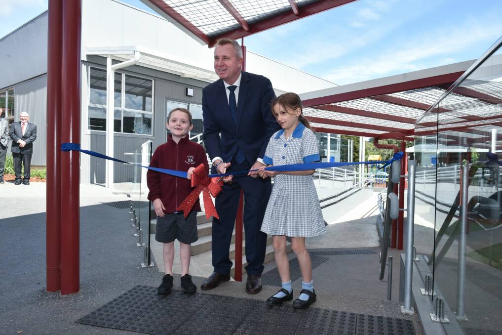 LEARN: Education Minister officially opens the new development with help from Hudson Forman, Grade 1, and Lily Gooding, Grade 3. Picture: Neil Richardson